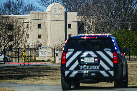 Police cruiser parked outside Congregation Beth Israel synagogue in Colleyville, Texas.